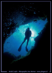 My wife going down the Cheminee.... on Comino Island - Ma... by Michel Lonfat 